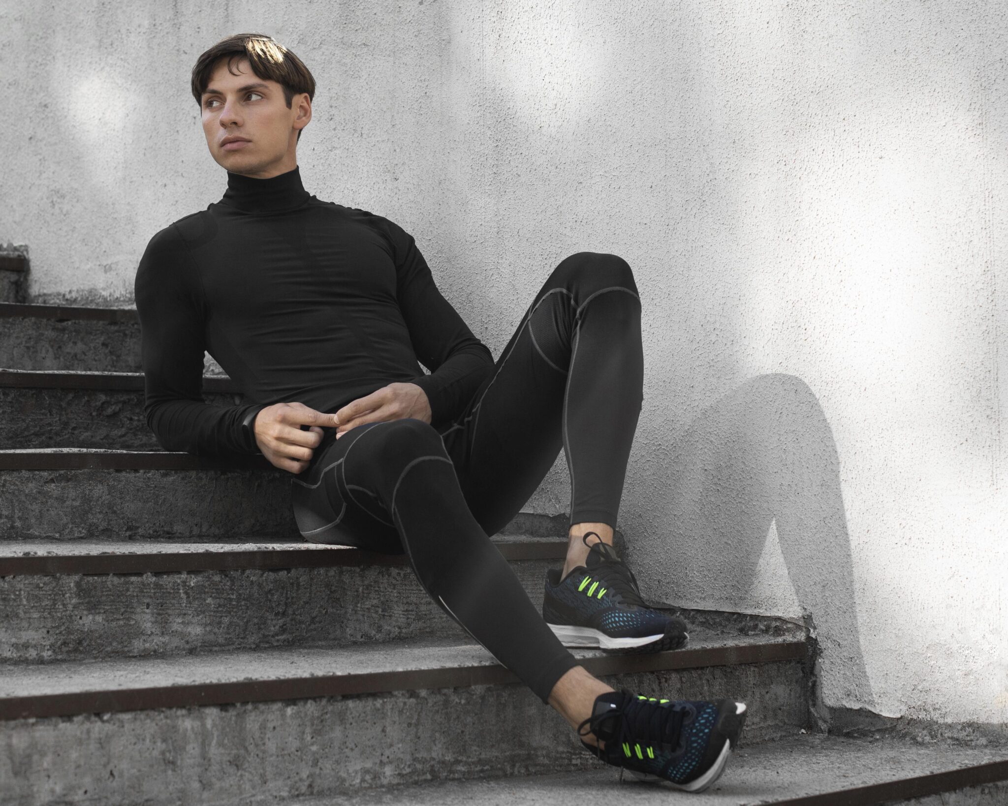 man athletic wear posing stairs outdoors